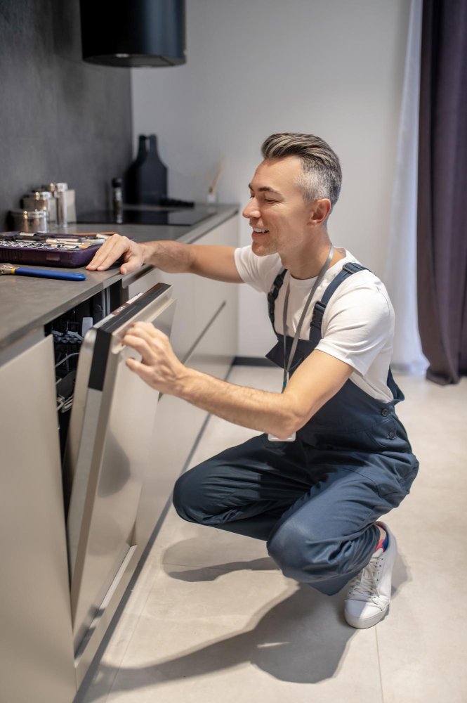 Dishwasher installation technician in action